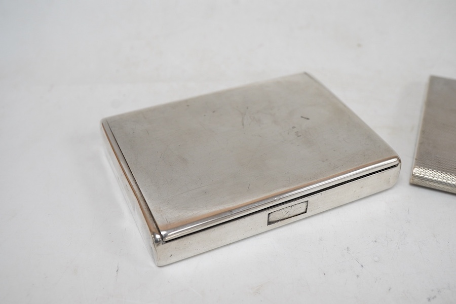 An engine turned 800 standard white metal cigarette case, 12cm, a 1920's Russian 875 standard white metal cigarette case and a white metal paper knife or page turner.